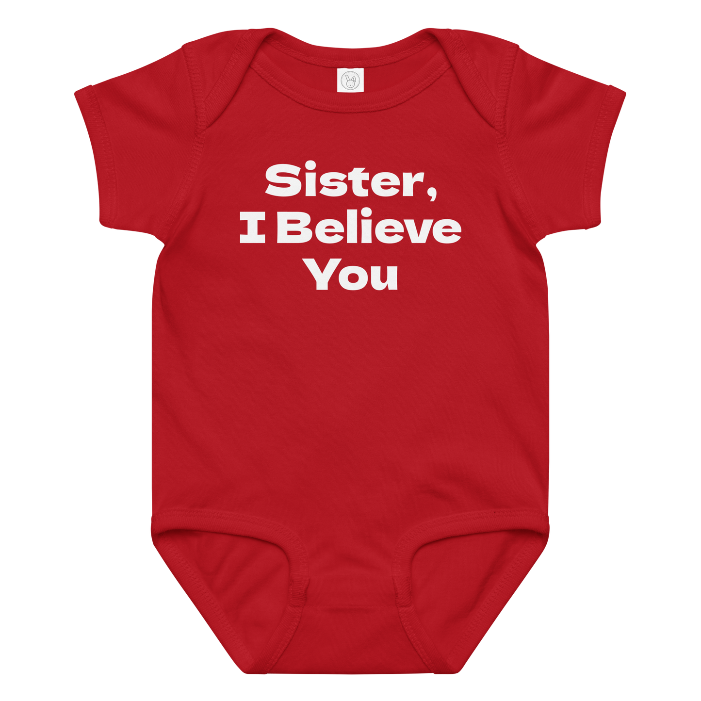 "Sister, I Believe You!" printed on a red baby jersey bodysuit laying on a flat surface amongst other clothes