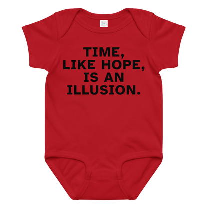 "Time, like hope, is an illusion" printed on a red baby jersey bodysuit laying on a flat surface amongst other clothes