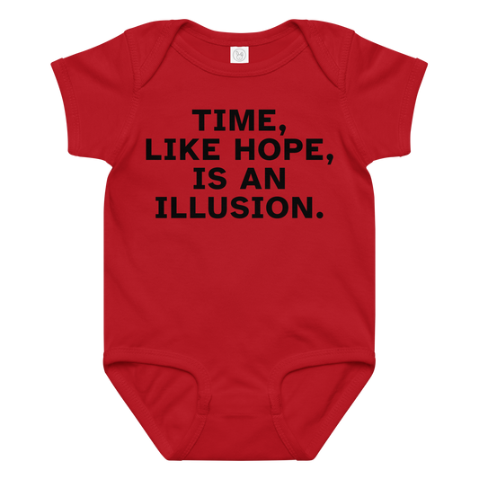 "Time, like hope, is an illusion" printed on a red baby jersey bodysuit laying on a flat surface amongst other clothes