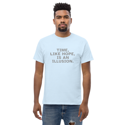 "Time, like hope, is an illusion" printed on a light blue unisex classic tee worn by a male