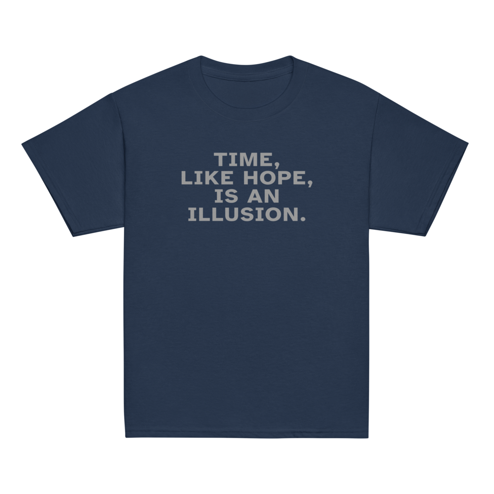 "Time, like hope, is an illusion" printed on a navy youth classic tee laying on a flat surface