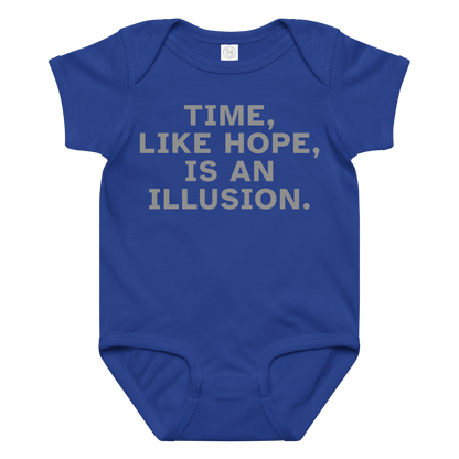 "Time, like hope, is an illusion" printed on a royal baby jersey bodysuit laying on a flat surface amongst other clothes