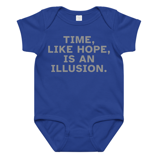 "Time, like hope, is an illusion" printed on a royal baby jersey bodysuit laying on a flat surface amongst other clothes