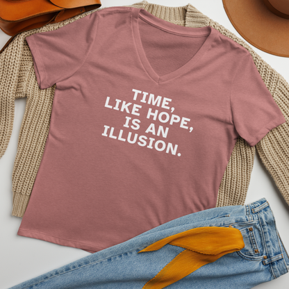 "Time, like hope, is an illusion" printed on a heather mauve women's relaxed v-neck t-shirt laying on a flat surface amongst other clothes