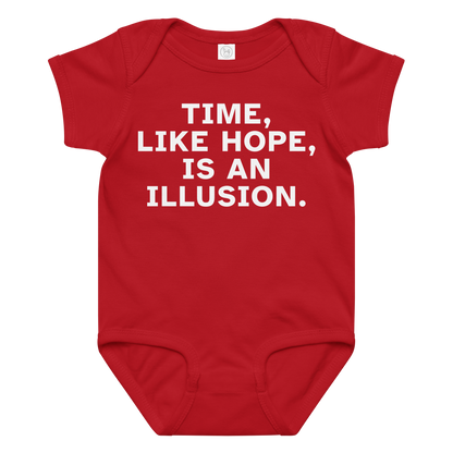 "Time, like hope, is an illusion" printed on a red baby jersey bodysuit laying on a flat surface amongst other clothes