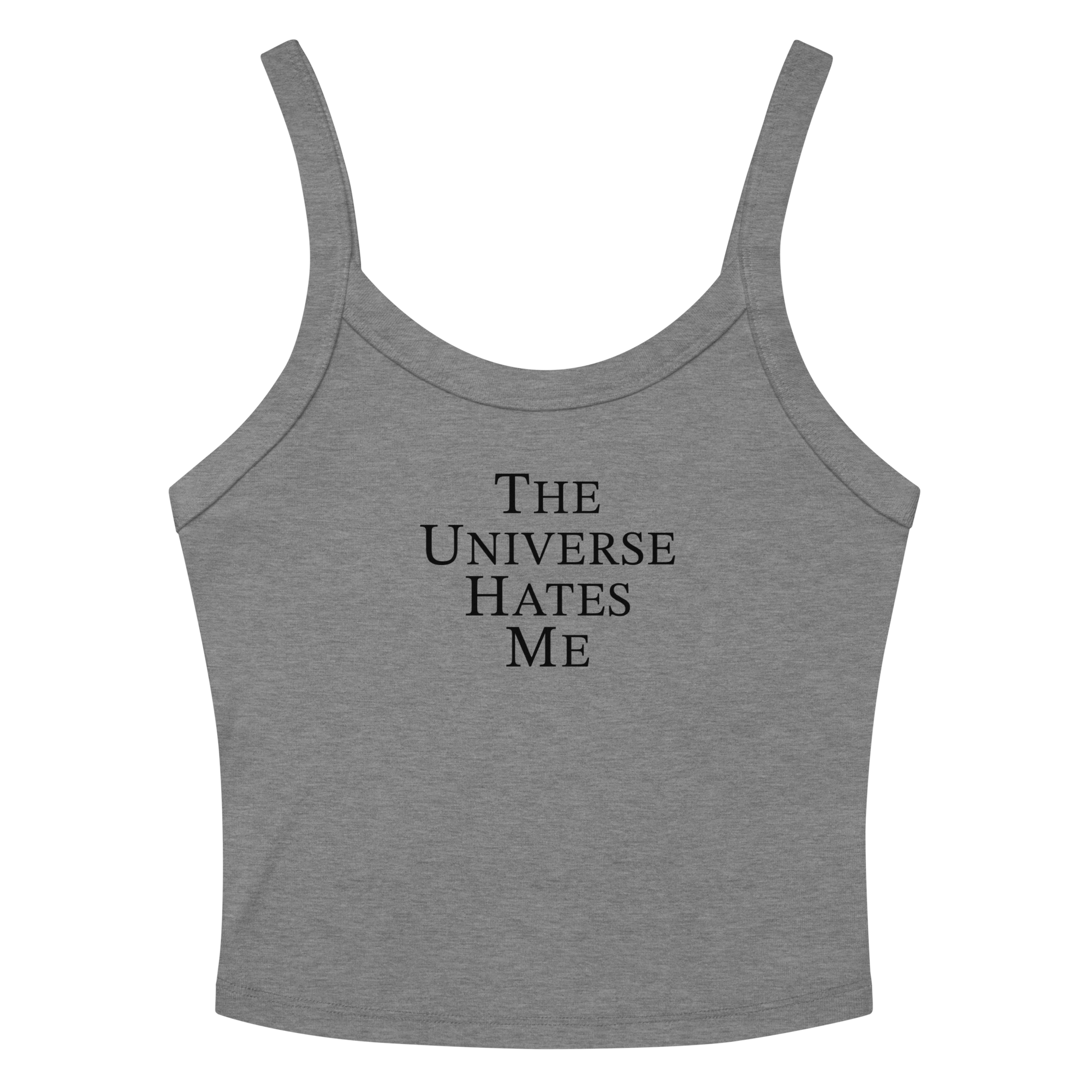 "The Universe Hates Me" printed on a athletic heather women's micro-rib tanktop laying on a flat surface amongst sunglasses and shorts