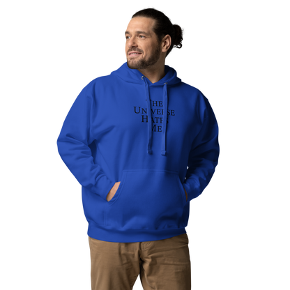 "The Universe Hates Me" printed on a team royal unisex hoodie worn by a male
