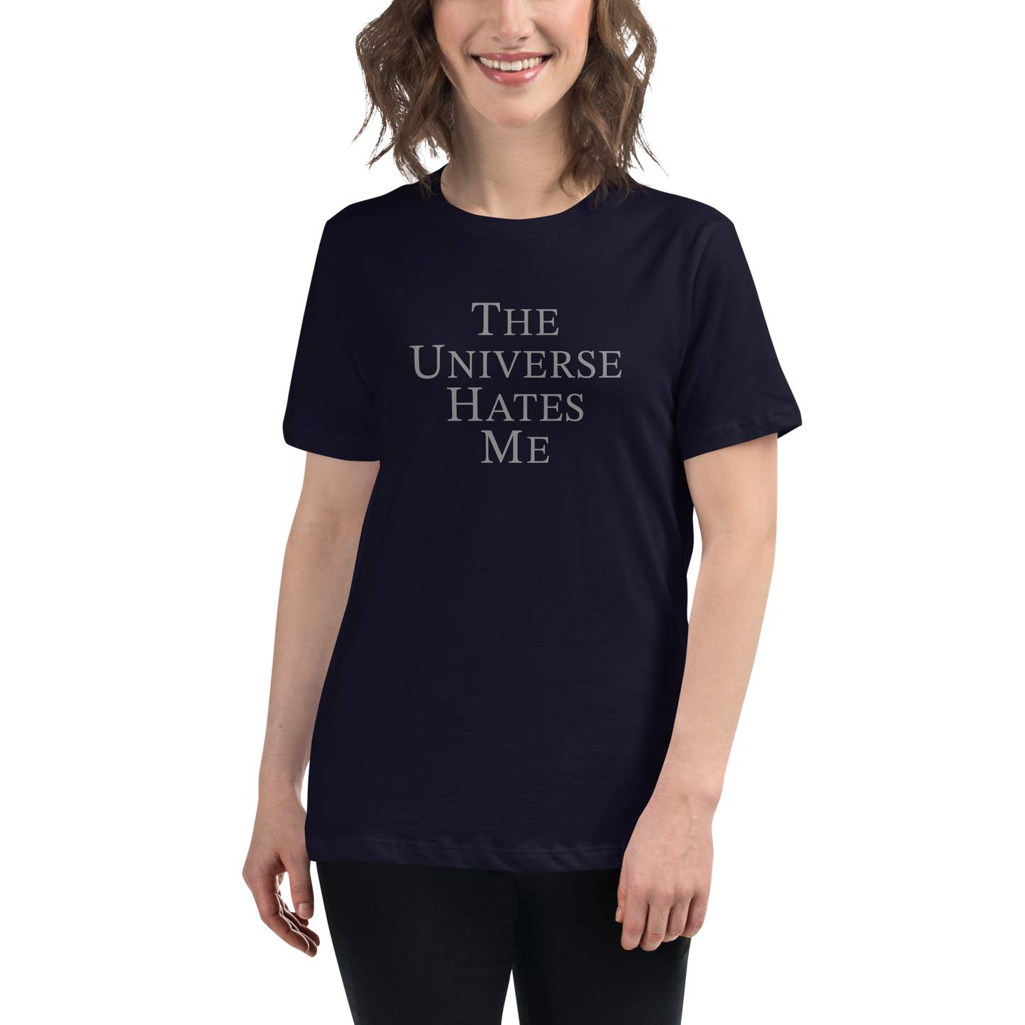 "The Universe Hates Me" printed on a navy women's relaxed t-shirt worn by a female
