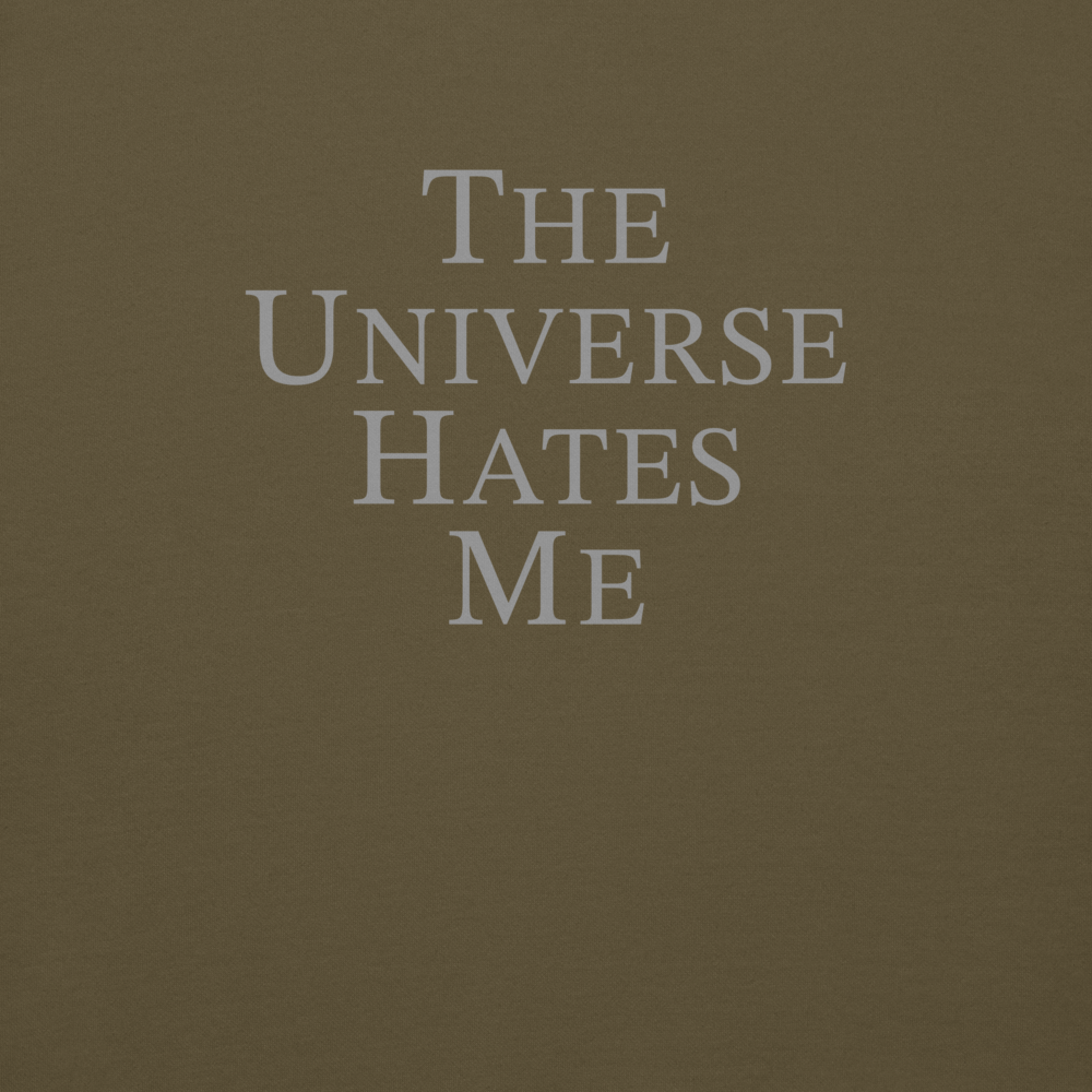 "The Universe Hates Me" printed on a military green background
