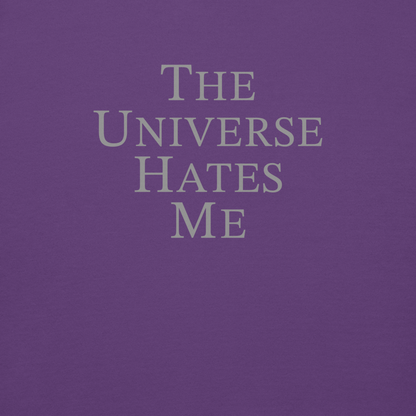 "The Universe Hates Me" printed on a purple background