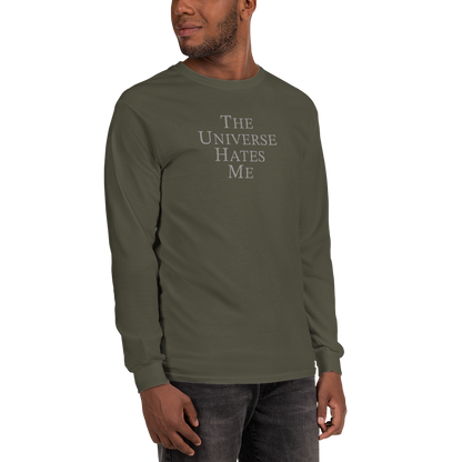 "The Universe Hates Me" printed on a military green men's long sleeve shirt worn by a male