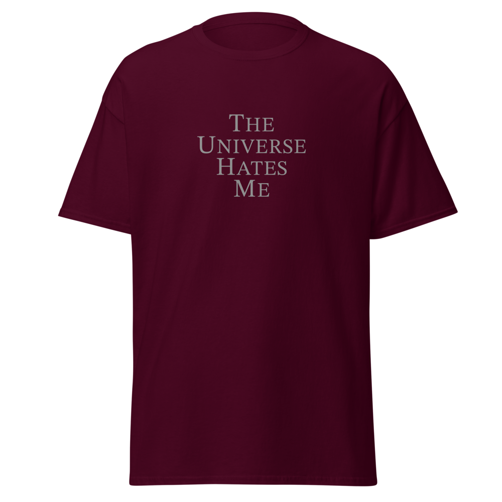 "The Universe Hates Me" printed on a maroon on an invisible body
