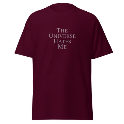 "The Universe Hates Me" printed on a maroon on an invisible body