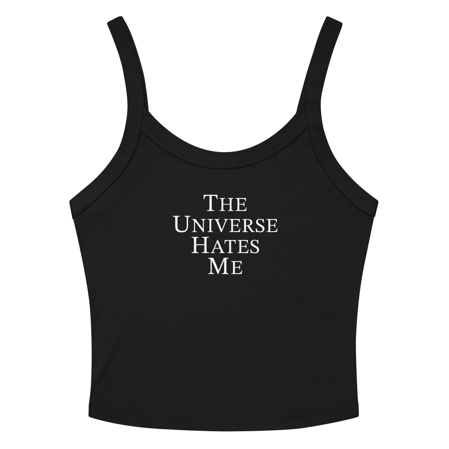 "The Universe Hates Me" printed on a solid black blend women's micro-rib tanktop laying on a flat surface amongst sunglasses and shorts