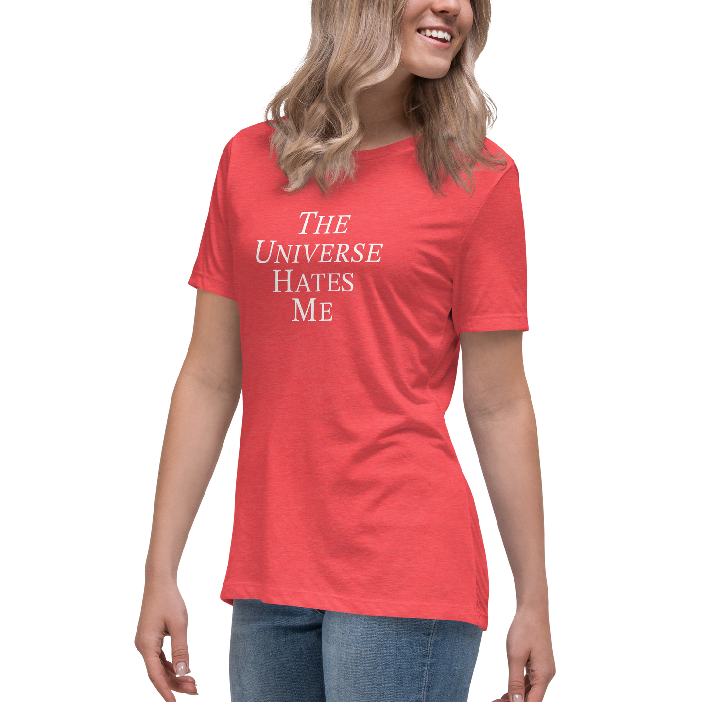 "The Universe Hates Me" printed on a heather red women's relaxed t-shirt worn by a female
