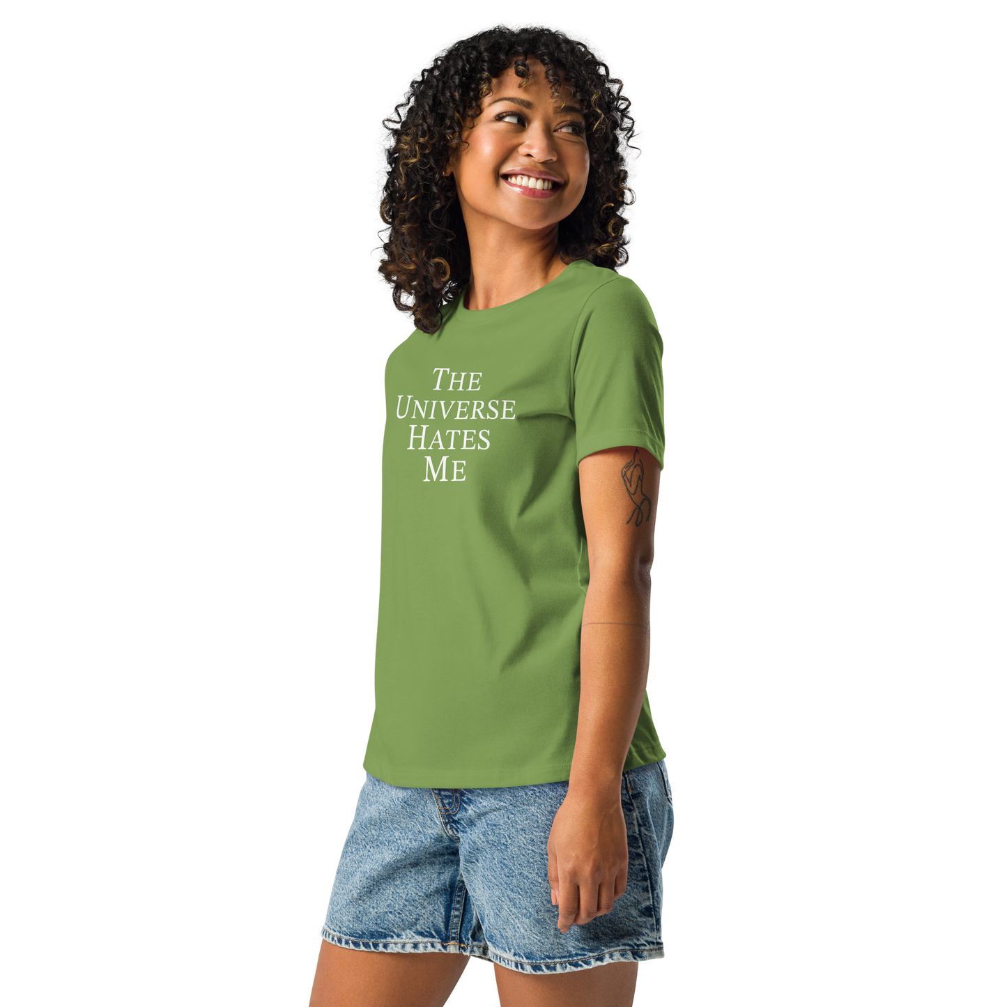 "The Universe Hates Me" printed on a leaf women's relaxed t-shirt worn by a female