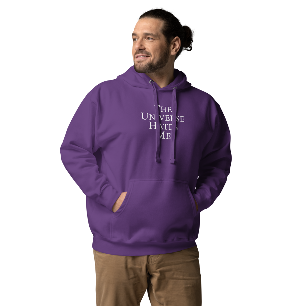 "The Universe Hates Me" printed on a purple unisex hoodie worn by a male