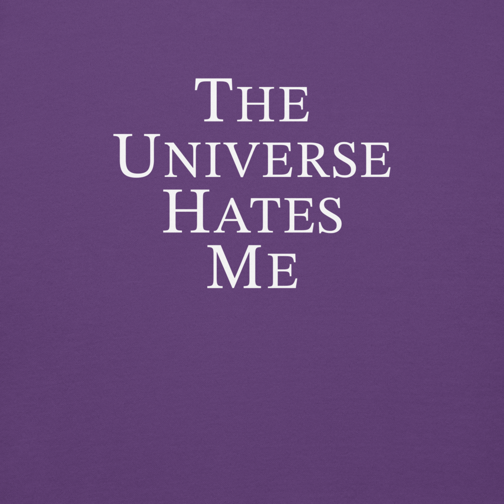 "The Universe Hates Me" printed on a purple background