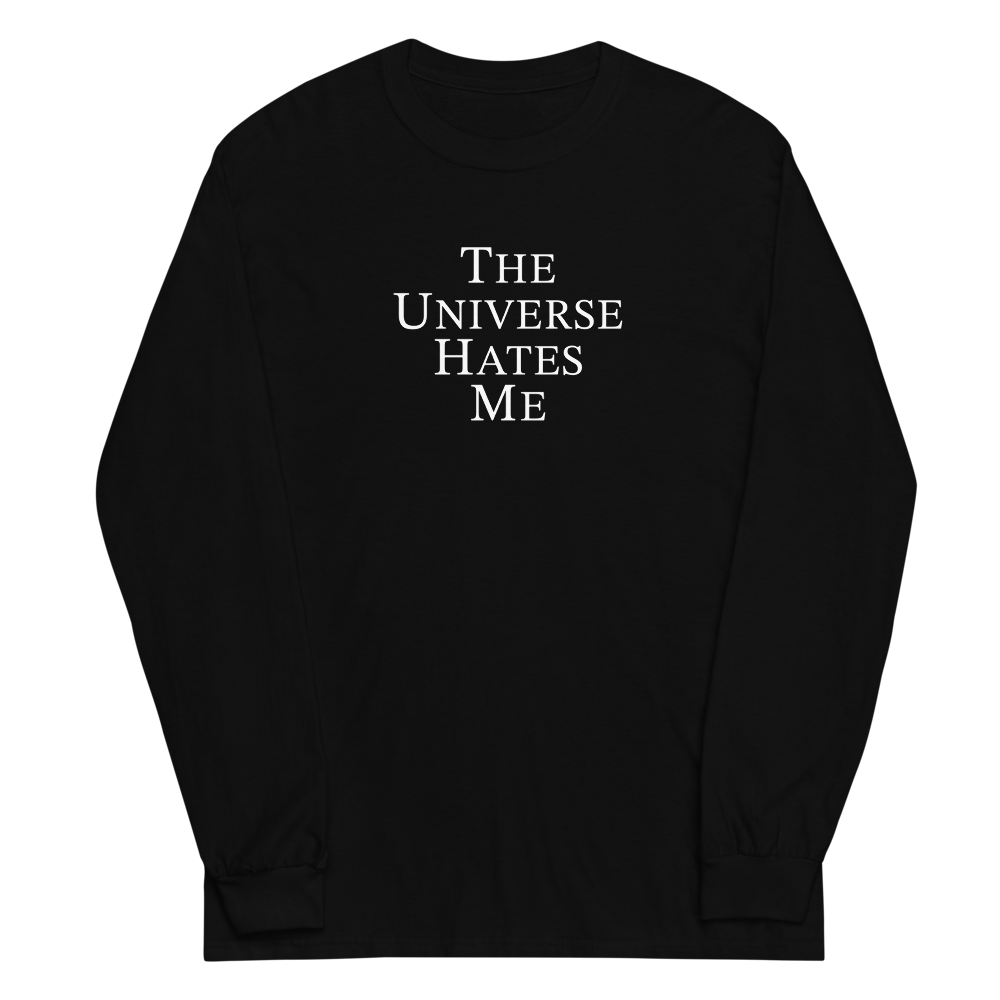 "The Universe Hates Me" printed on a black men's long sleeve shirt laying on a flat surface