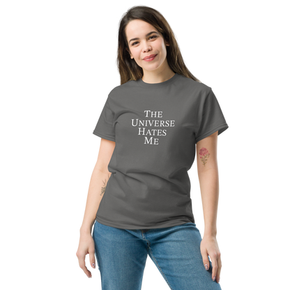 "The Universe Hates Me" printed on a charcoal unisex classic tee worn by a female