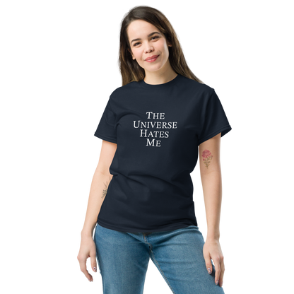 "The Universe Hates Me" printed on a navy unisex classic tee worn by a female