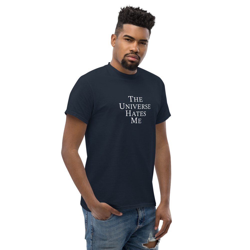 "The Universe Hates Me" printed on a navy unisex classic tee worn by a male