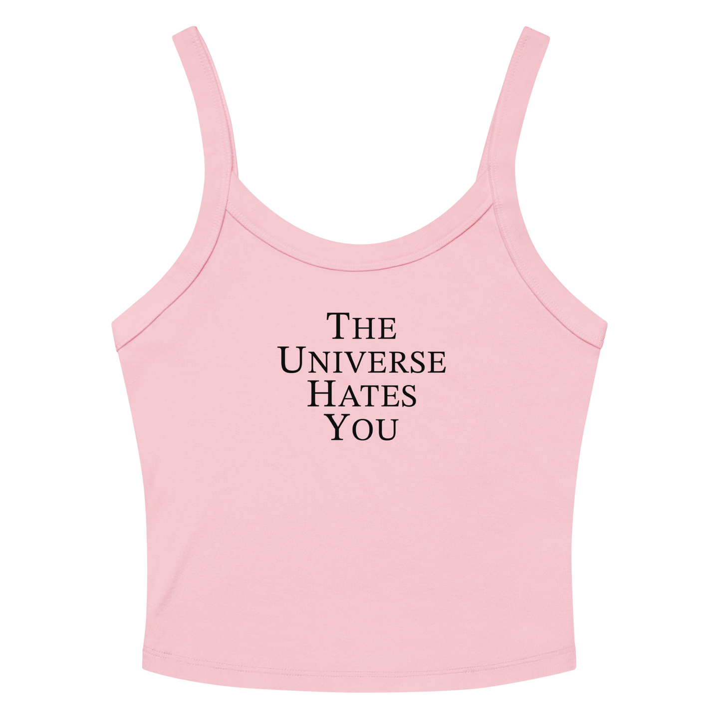 "The Universe Hates You" printed on a solid pink blend women's micro-rib tanktop laying on a flat surface amongst sunglasses and shorts