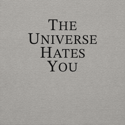 "The Universe Hates You" printed on a carbon grey background