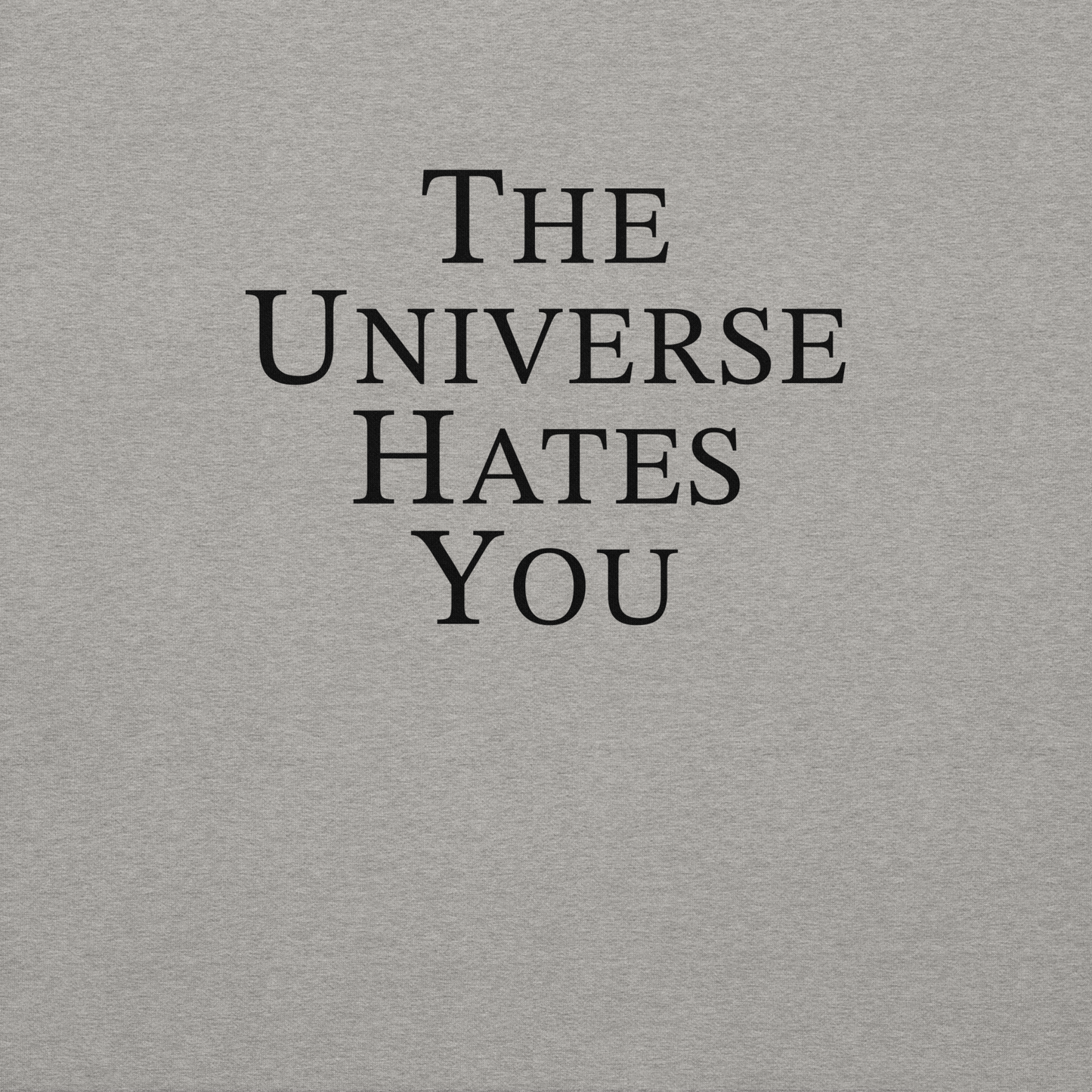 "The Universe Hates You" printed on a carbon grey background