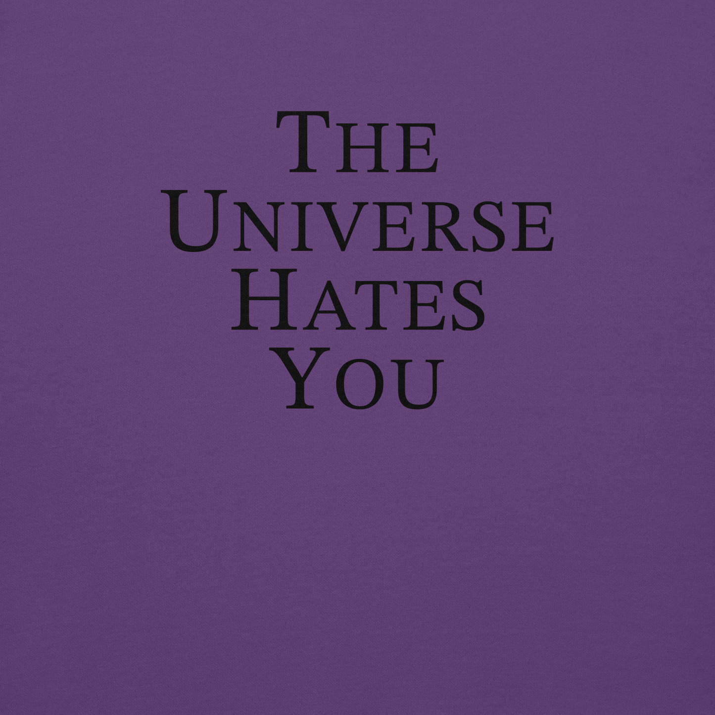 "The Universe Hates You" printed on a purple background