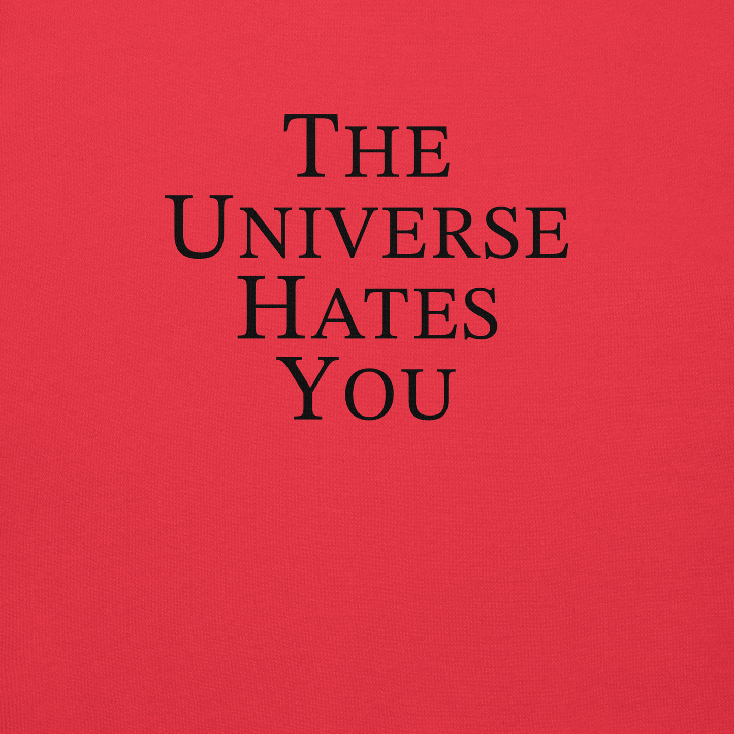 "The Universe Hates You" printed on a team red background