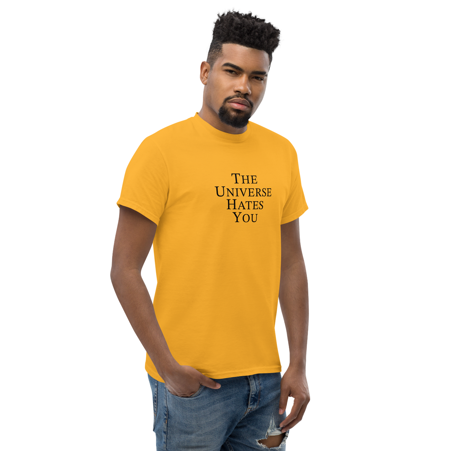 "The Universe Hates You" printed on a gold unisex classic tee worn by a male