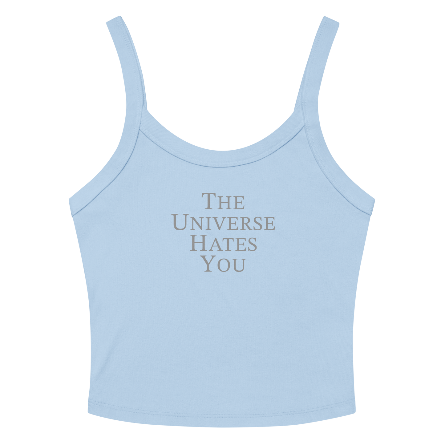 "The Universe Hates You" printed on a solid baby blue blend women's micro-rib tanktop laying on a flat surface amongst sunglasses and shorts