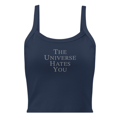 "The Universe Hates You" printed on a solid navy blend women's micro-rib tanktop laying on a flat surface