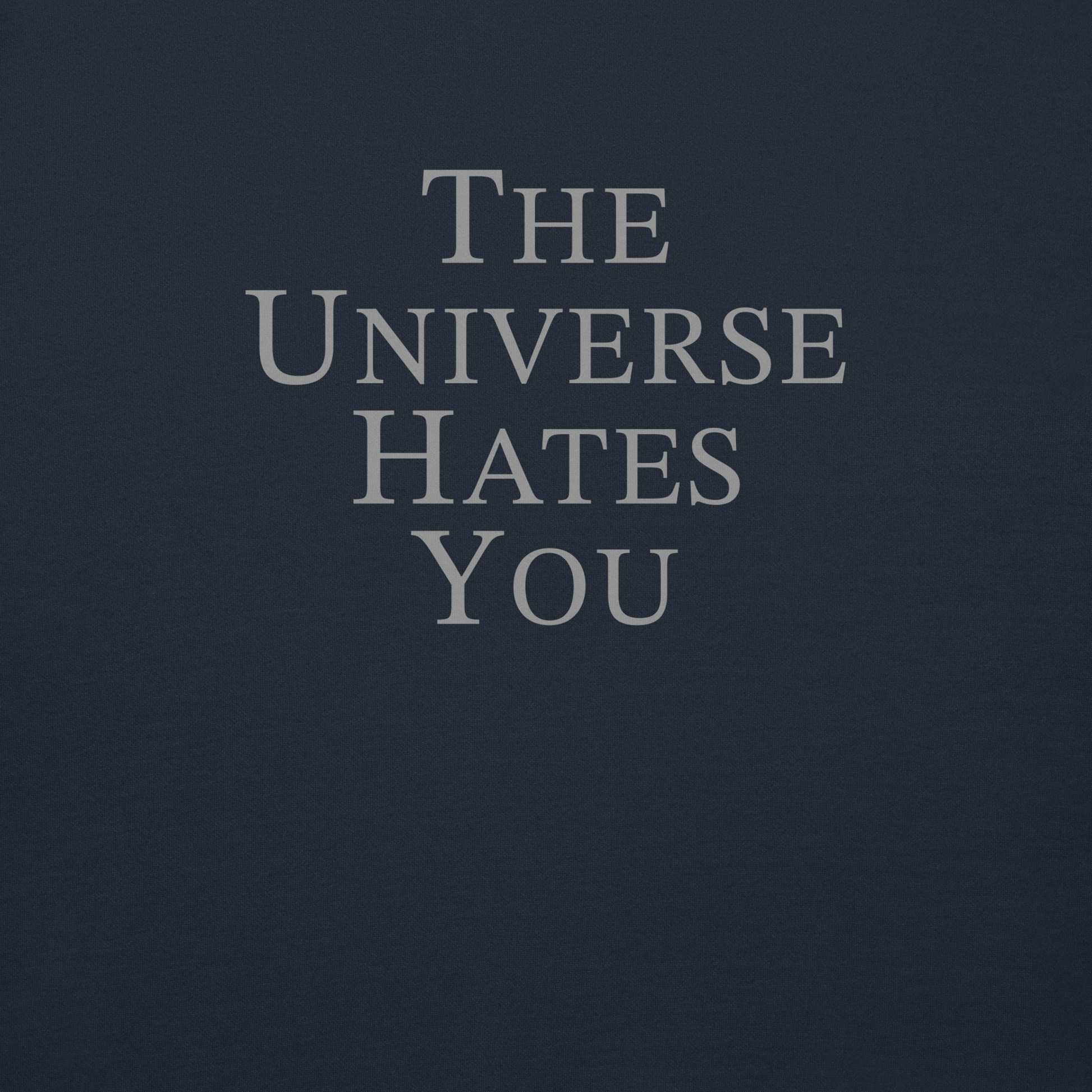 "The Universe Hates You" printed on a navy blazer background