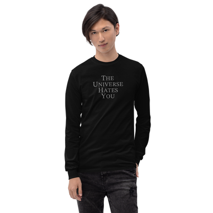 "The Universe Hates You" printed on a black men's long sleeve shirt worn by a male