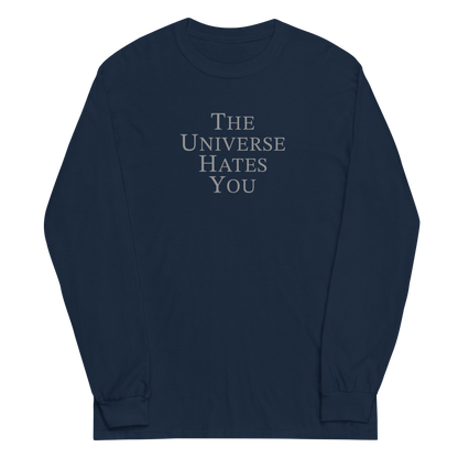 "The Universe Hates You" printed on a navy men's long sleeve shirt laying on a flat surface