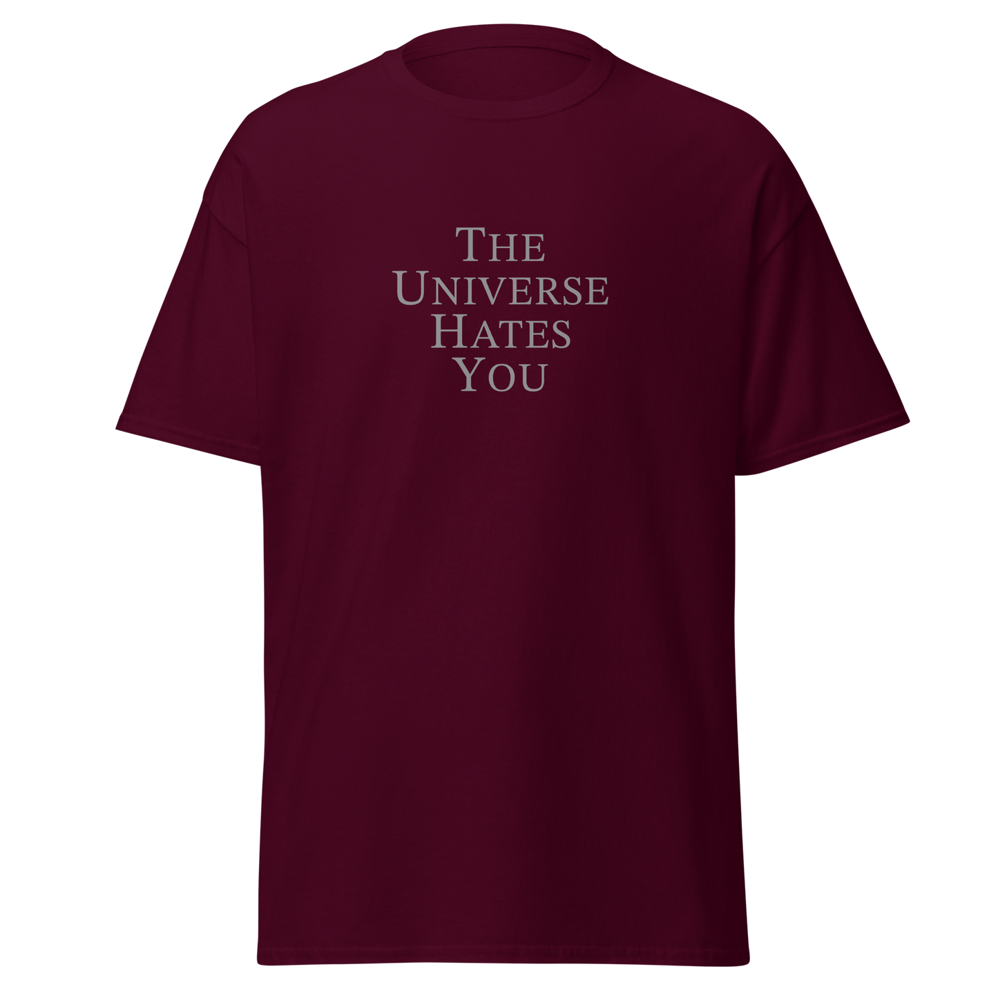 "The Universe Hates You" printed on a maroon on an invisible body