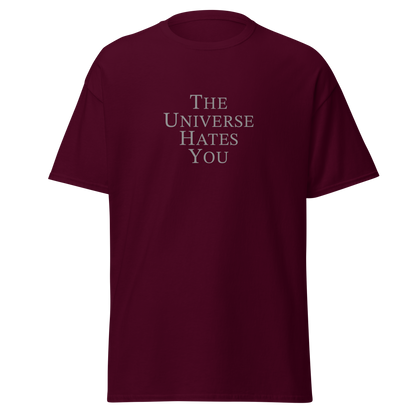 "The Universe Hates You" printed on a maroon on an invisible body