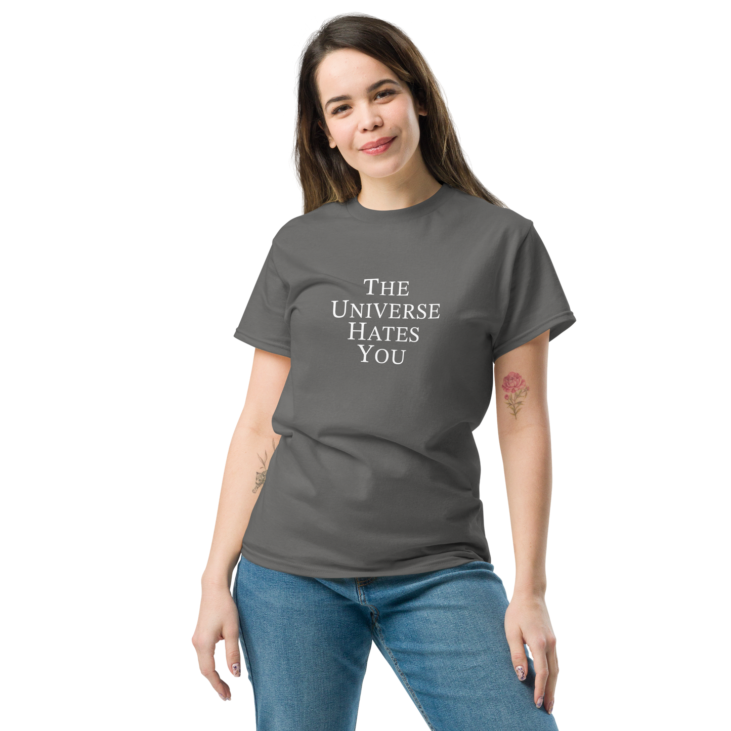 "The Universe Hates You" printed on a charcoal unisex classic tee worn by a female