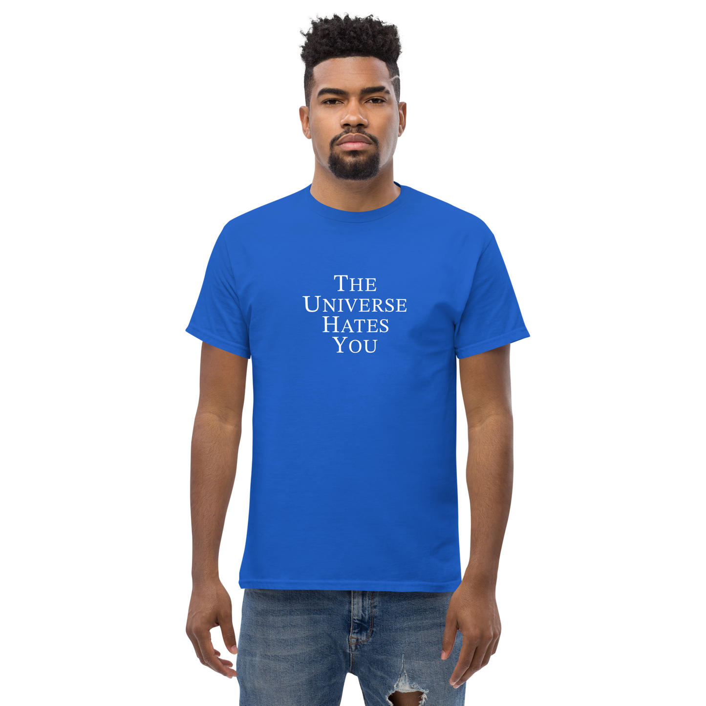 "The Universe Hates You" printed on a royal unisex classic tee worn by a male