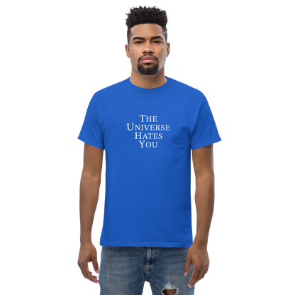 "The Universe Hates You" printed on a royal unisex classic tee worn by a male