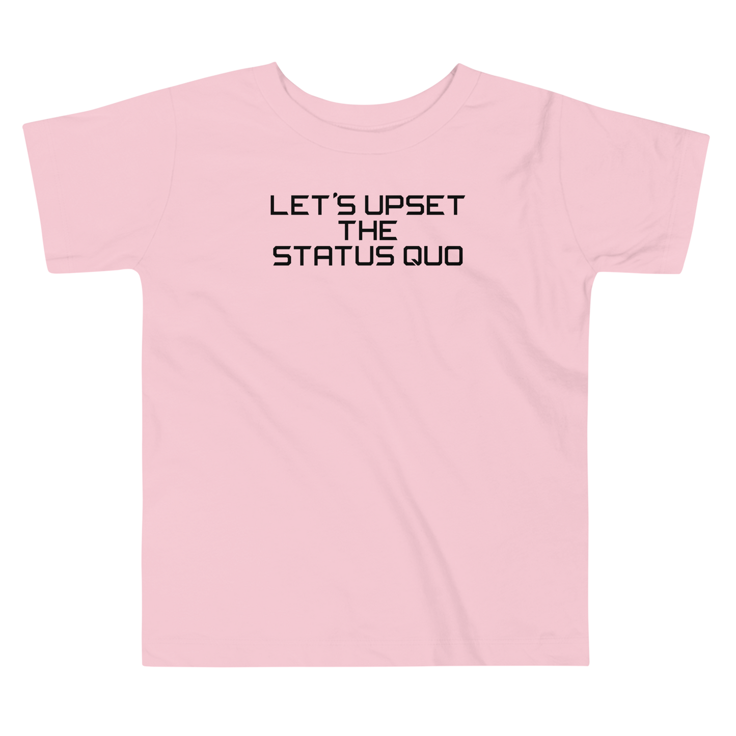 "Let's upset the status quo!" printed on a pink toddler short sleeve tee laying on a flat surface