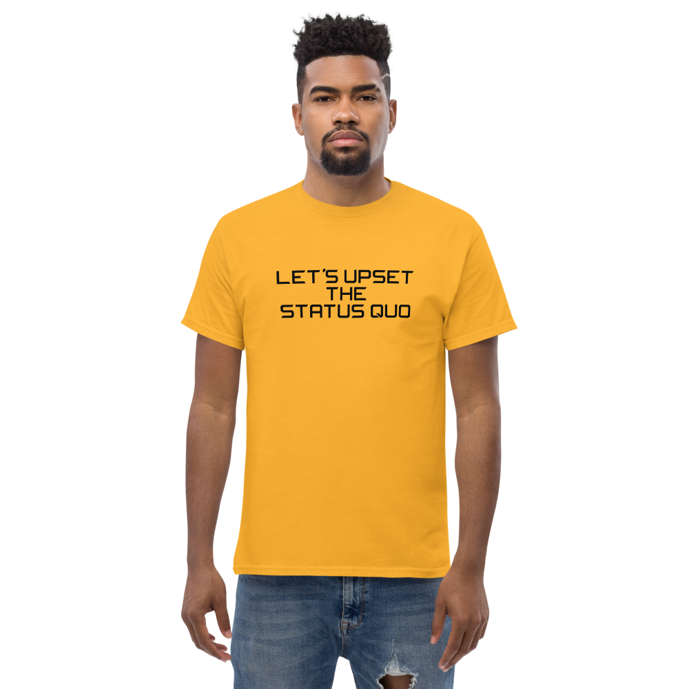 "Let's upset the status quo!" printed on a gold unisex classic tee worn by a male