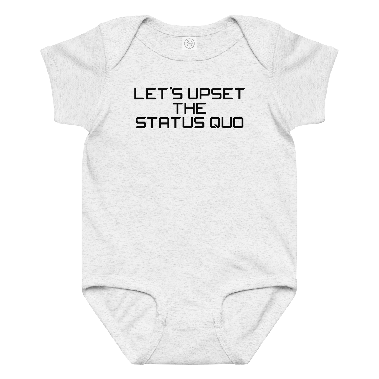 "Let's upset the status quo!" printed on a ash baby jersey bodysuit laying on a flat surface amongst other clothes