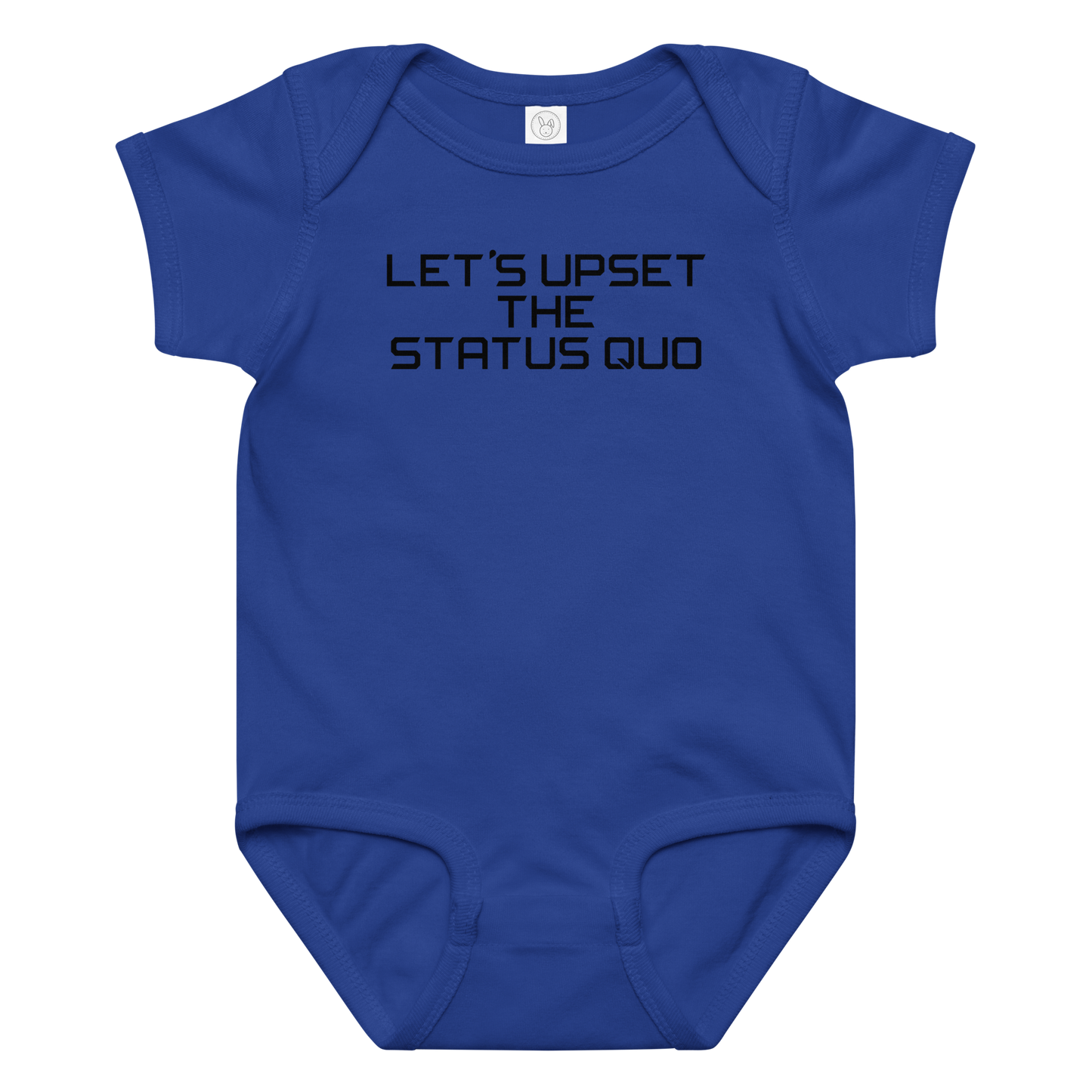 "Let's upset the status quo!" printed on a royal baby jersey bodysuit laying on a flat surface amongst other clothes