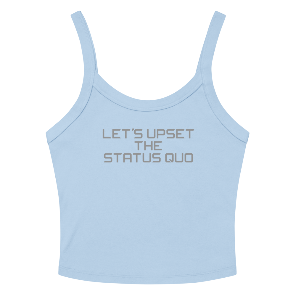 "Let's upset the status quo!" printed on a solid baby blue blend women's micro-rib tanktop laying on a flat surface amongst sunglasses and shorts