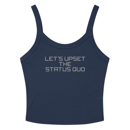 "Let's upset the status quo!" printed on a solid navy blend women's micro-rib tanktop laying on a flat surface amongst sunglasses and shorts
