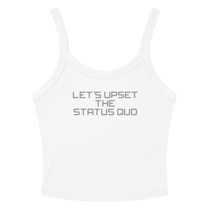 "Let's upset the status quo!" printed on a solid white blend women's micro-rib tanktop laying on a flat surface amongst sunglasses and shorts