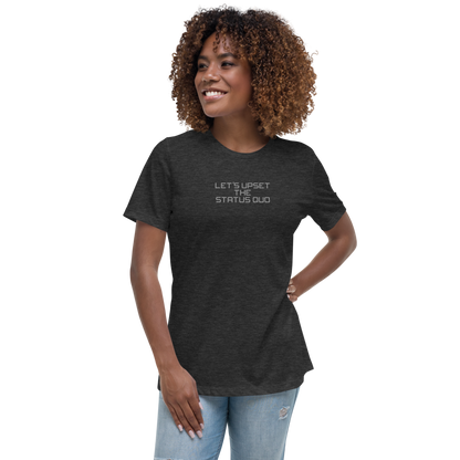 "Let's upset the status quo!" printed on a dark grey heather women's relaxed t-shirt worn by a female